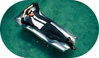 Image of a man lying on a pool float in a pool